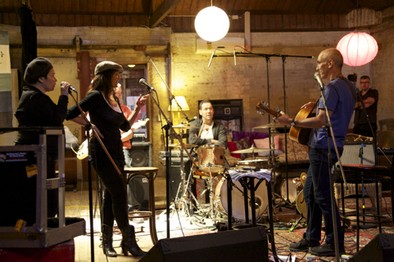 Paul Kelly recording in a warehouse